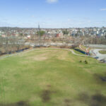 Merino Park bird's eye view of soccer field in 2021 with pedestrian bridge to Olneyville visible