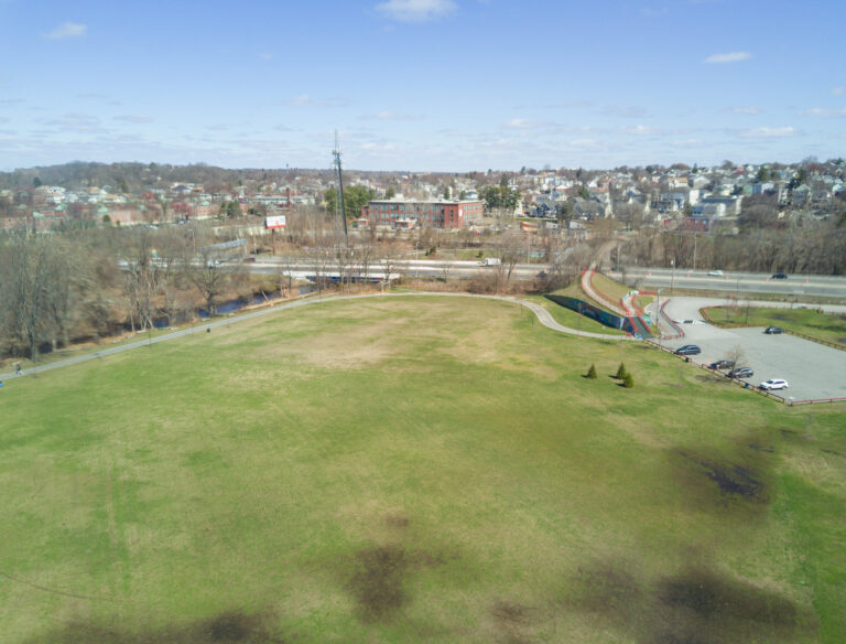 Merino Park bird's eye view of soccer field in 2021 with pedestrian bridge to Olneyville visible