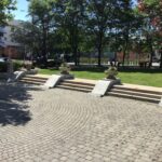 Photo shows stairs, planters, and plaza area of St. John