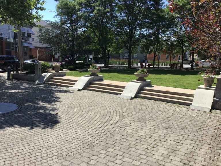 Photo shows stairs, planters, and plaza area of St. John's Park