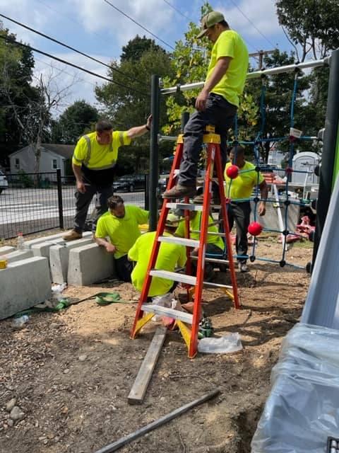 Parks crew installing Playground equipment at Viscolosi Park
