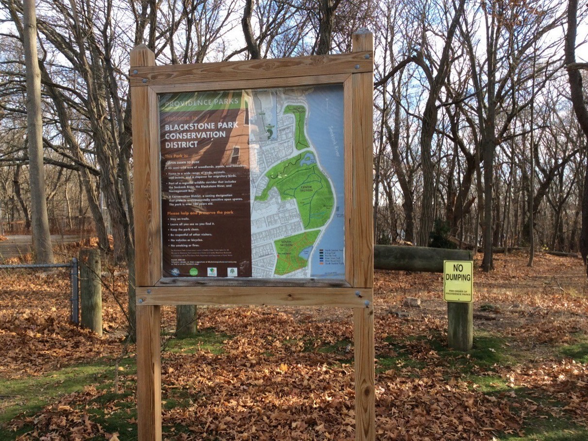photo of a kiosk displaying trail maps