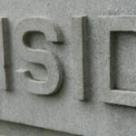 closeup photo of a carving of the word "Burnside"