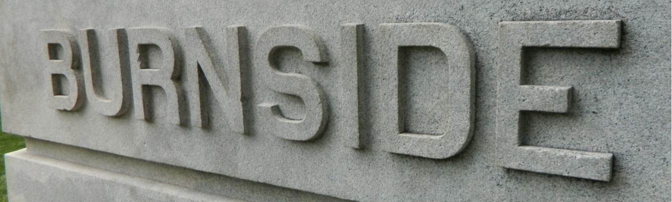 closeup photo of a carving of the word "Burnside"