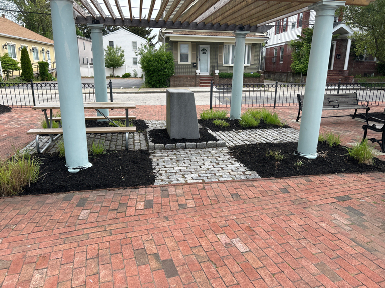 photo showing brick pavers under a gazebo