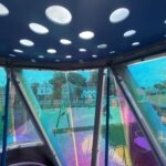 Neutaconkanut playground tower for ages 5-12 view of inside with perforated and colorful dichroic panel