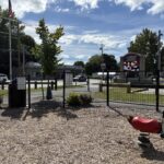 Neutaconkanut playground entrance at Plainfield St with spring rocker for ages 2-5
