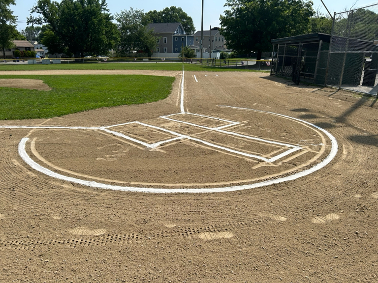 Neutaconkanut Little League field first base line July 2026
