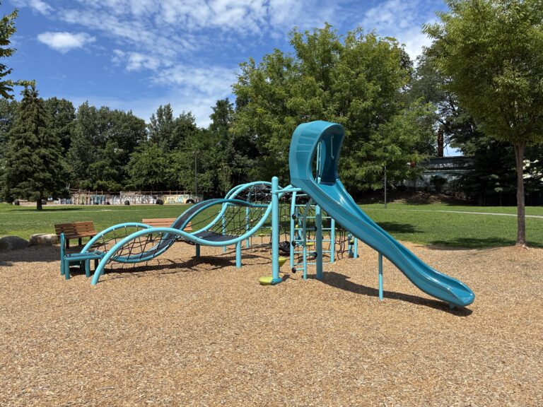 Father Lennon Park Playground for Ages 5-12 featuring slide and rope/belt climber
