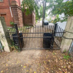 Franciscan Park Bell St Entrance gate looking out toward Broadway