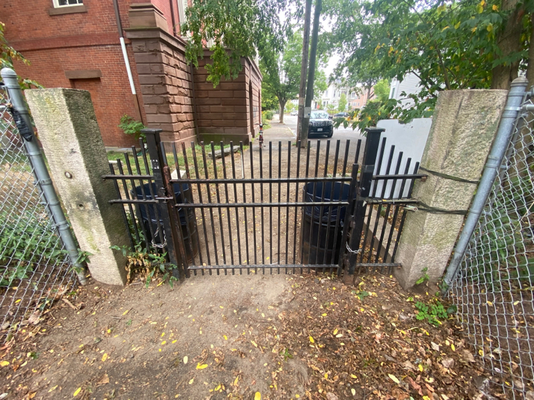 Franciscan Park Bell St Entrance gate looking out toward Broadway