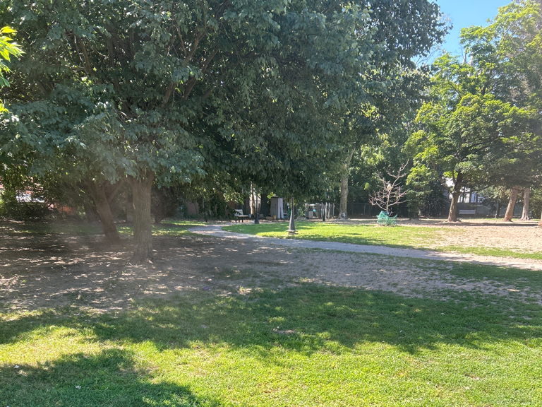 Franciscan Park walking path and grass with ample shade
