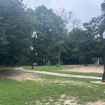 Franciscan Park lit walking path with open area for dogs