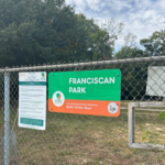 Franciscan Park entrance sign on Ridge St near Tobey St
