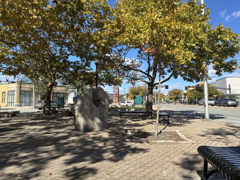 Columbus Square in the fall facing north with seating areas and shade trees