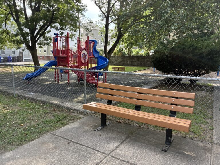George Araujo Park bench outside of the playground area for ages 2-12
