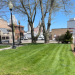 Garibaldi Square side lawn along Enterprise Row with Providence skyline in background