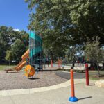 General Street Park view from the picnic table at the water park towards the playground for ages 2-12