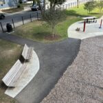 General Street Park view of the seating and waterpark entrance from high on the play equipment