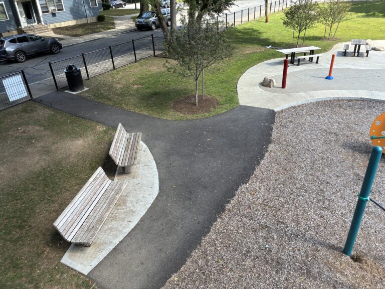 General Street Park view of the seating and waterpark entrance from high on the play equipment