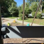 Gladys Potter Park view from play tower of the classic concrete frog sculptures
