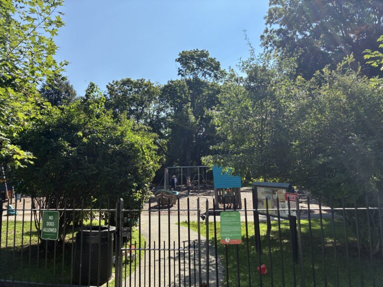 Gladys Potter Park gate on Humboldt Ave with bulletin board