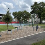 Harriet & Sayles Park fitness area for ages 13+ with basketball court in background