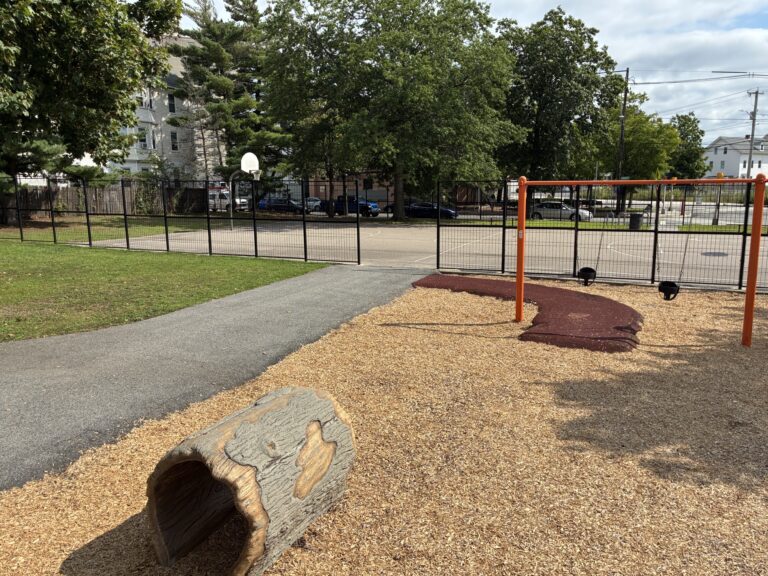 Hassett Park looking south to basketball court from playground crawl tube
