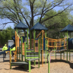 Hassett Park in Spring 2025. Play structure for ages 2-12 features two slides