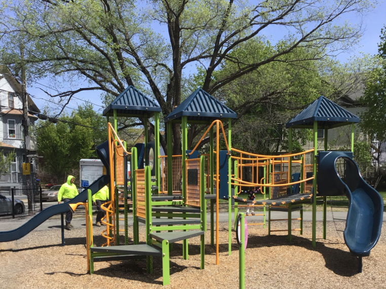 Hassett Park in Spring 2025. Play structure for ages 2-12 features two slides