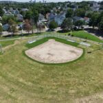 Iola French Park birds eye view of softball field under construction with Providence skyline in the background