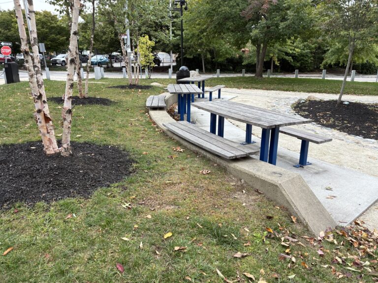Jacqueline Clements Park picnic area features a seating wall and three tables including one ADA-accessible table