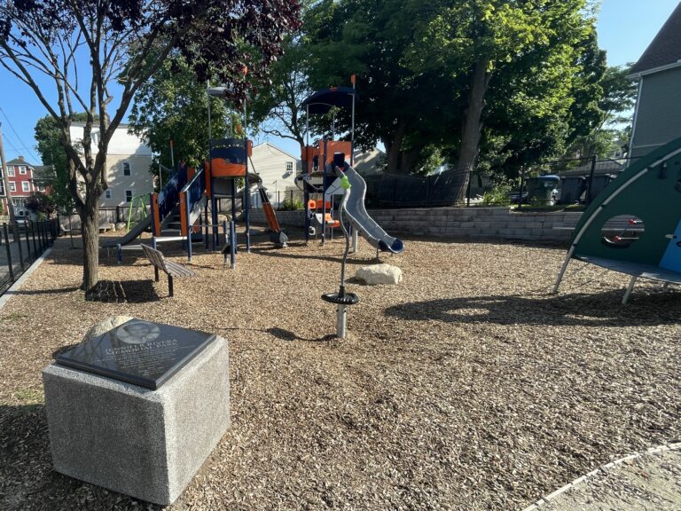 Jennifer Rivera Park from inside the park entrance viewing the memorial and various playground equipment