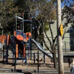 Jennifer Rivera Park view from Niagara St of the play structures for ages 5-12 featuring two slides