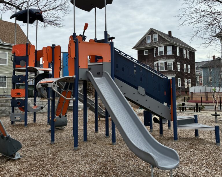 Jennifer Rivera Park play structure for ages 5-12 has one pod accessible via transfer stairs with a straight slide