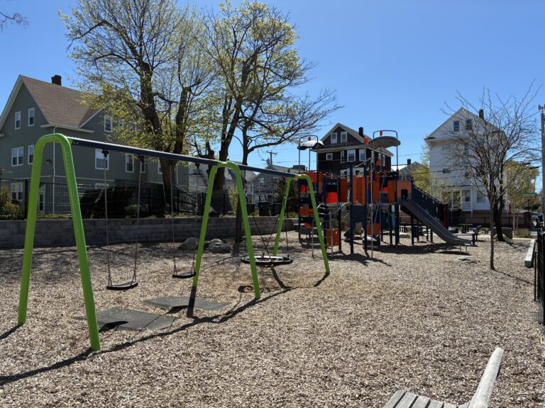 Jennifer Rivera Park taking in early spring blooms and sunshine from the northwest corner park benches
