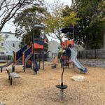Jennifer Rivera Park playground features two slides for ages 5-12 and an upright spinner