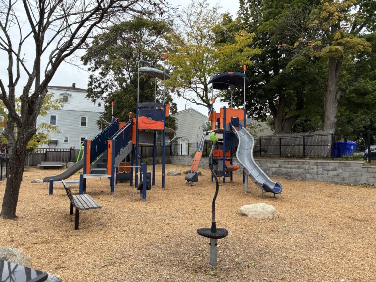 Jennifer Rivera Park playground features two slides for ages 5-12 and an upright spinner