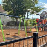 Jennifer Rivera Park walking south on Niagara approaching the playground entrance with anticipation