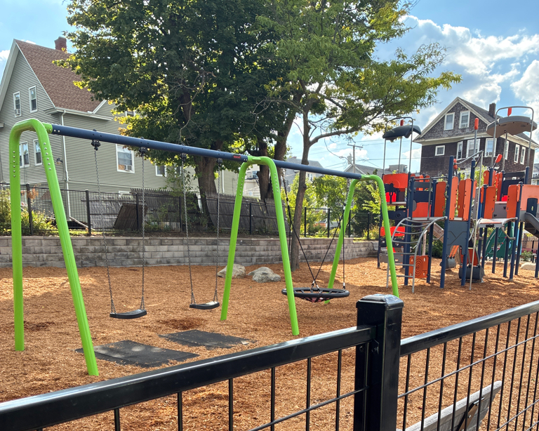 Jennifer Rivera Park walking south on Niagara approaching the playground entrance with anticipation