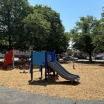 O'Brien Park playground for ages 2-5 with slide, rope climber, spinners, and spring rockers