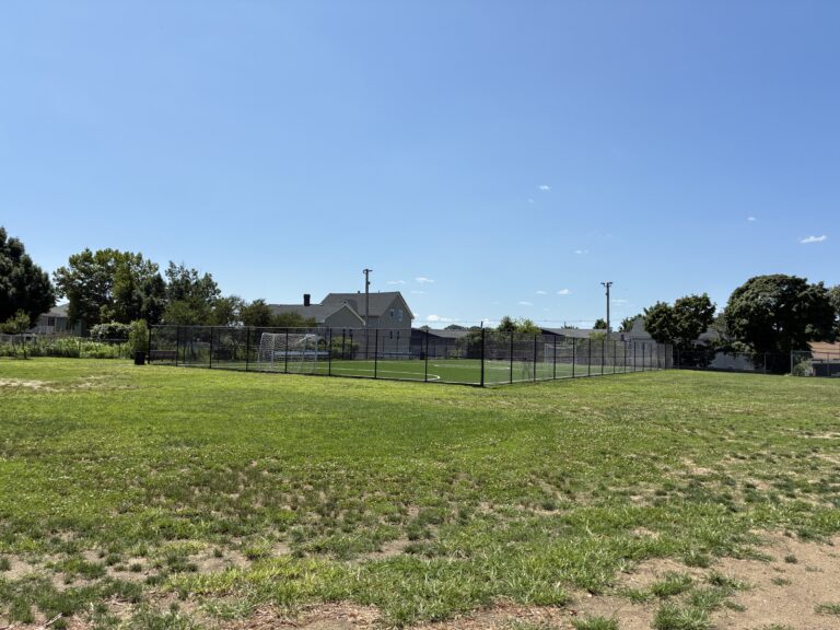 Joslin Park open field giving way to fenced synthetic turf futsal pitch
