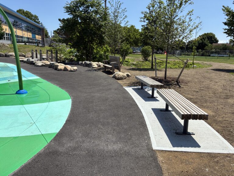 Joslin Park perimeter seating on the walking path around the splash pad