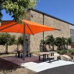 Joslin Park splashpad picnic area with shade sail