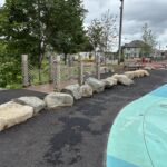 Joslin Park splashpad rebuilt in 2026 retained the original bridge feature separating the waterpark from the rain garden