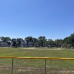 Joe Williams Field the baseball diamond viewed from the playground behind left field fence