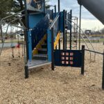 Joe Williams playground structure for ages 5-12 includes tic-tac-toe and a variety of climbers