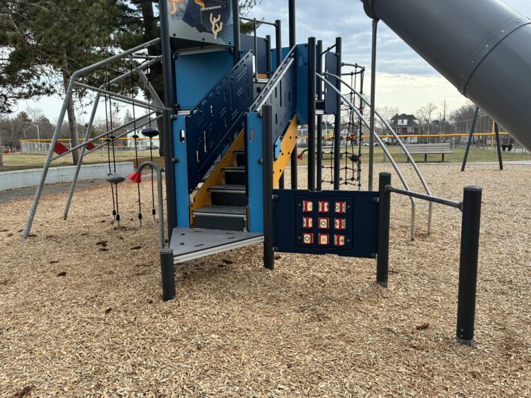 Joe Williams playground structure for ages 5-12 includes tic-tac-toe and a variety of climbers