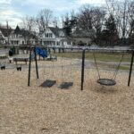 Joe Williams playground swings and 2-5 play area as viewed from atop the giant tower play structure