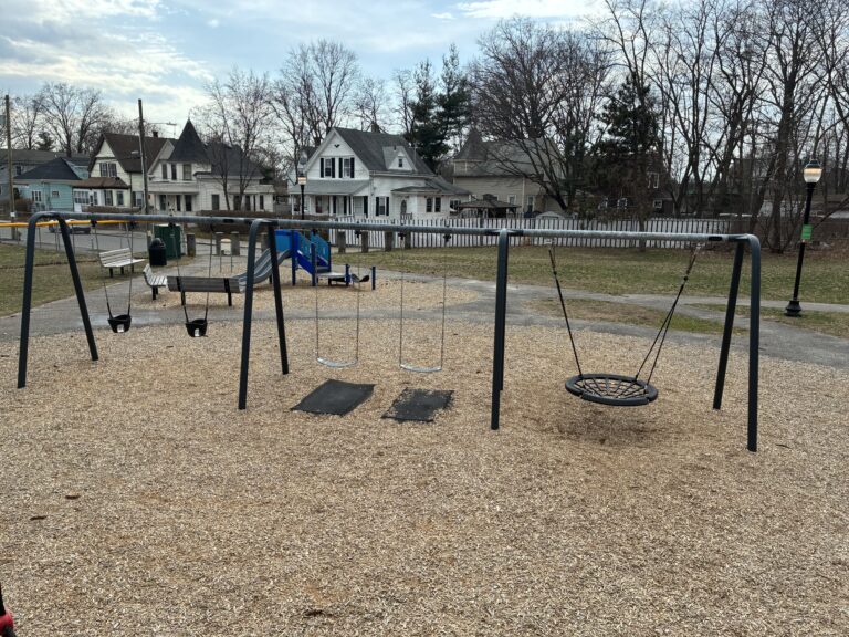 Joe Williams playground swings and 2-5 play area as viewed from atop the giant tower play structure